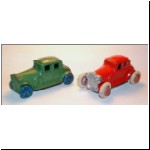 Slush-cast copies of the Coupe by Savoye, with headlights (red model is repainted)